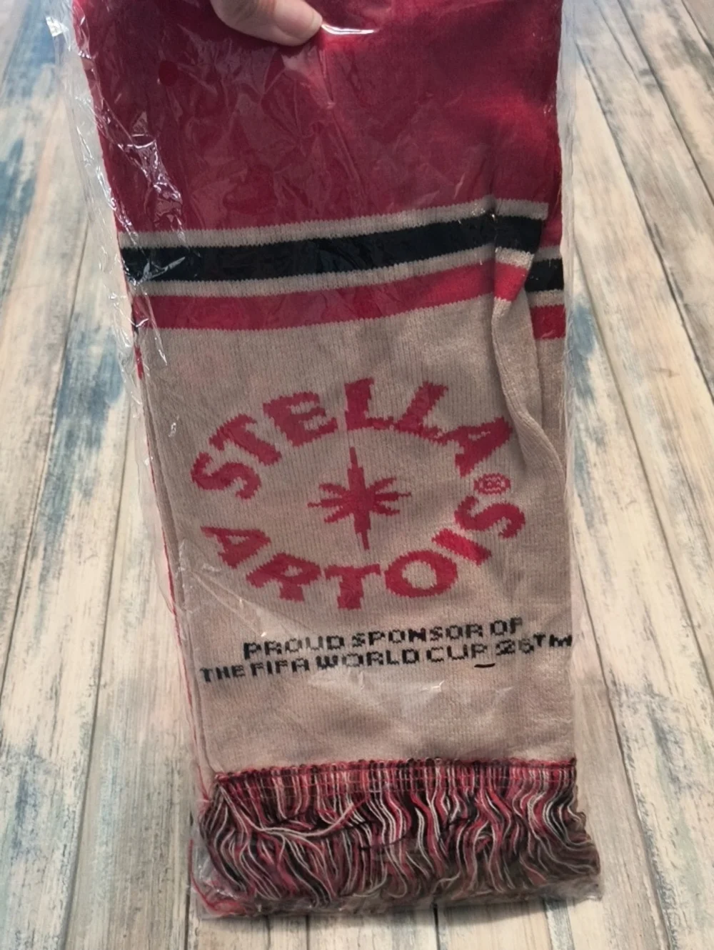 Stella Artois scarf is a promotional item for the 2026 FIFA World Cup